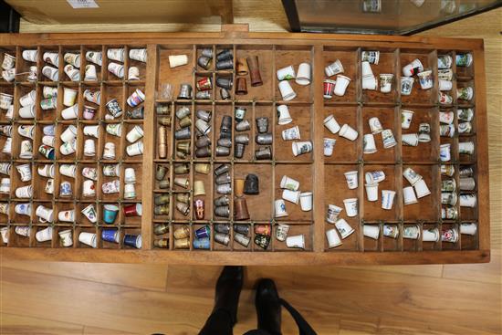 A collection of thimbles and thimble display units, books etc